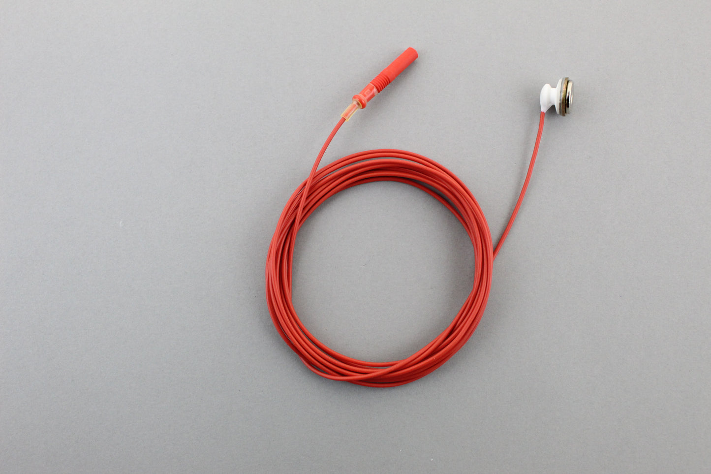 Snap button cable for disposable pad electrodes