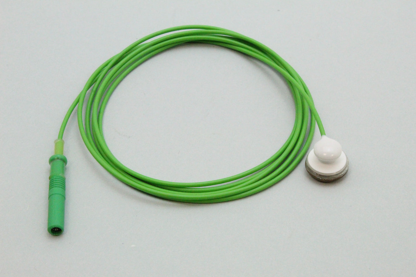 Snap button cable for disposable pad electrodes